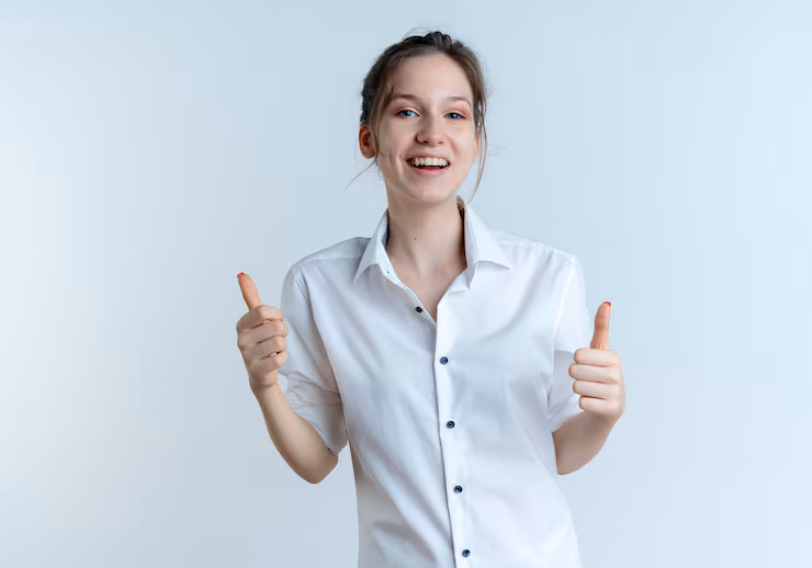 young-smiling-blonde-russian-girl-thumbs-up-with-two-hands-isolated-white-space-with-copy-space_141793-60330